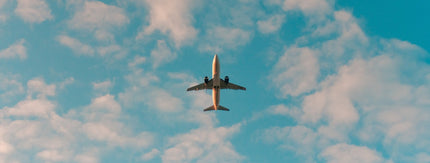 aeroplane in the sky with clouds
